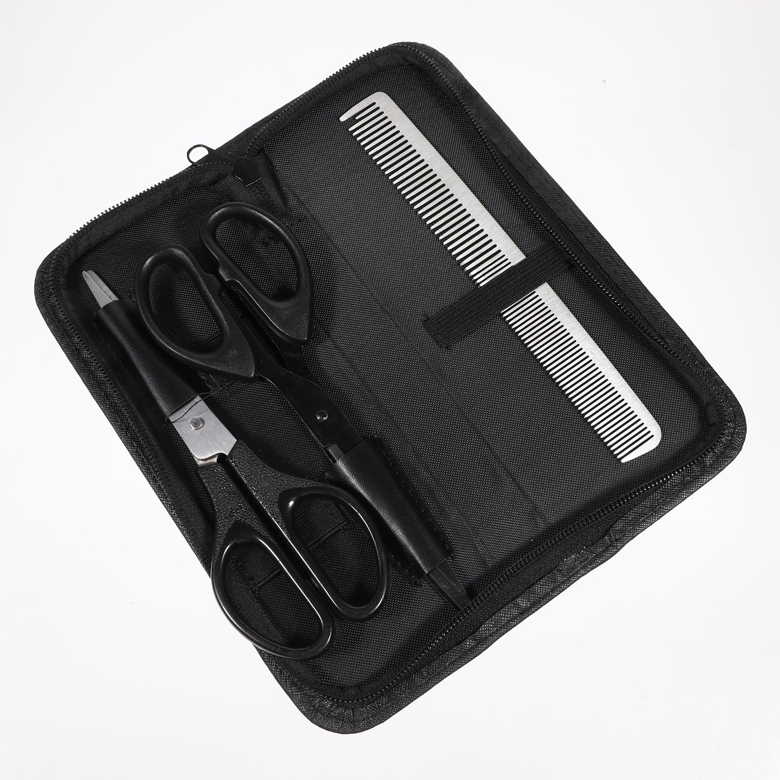 Zelphvt hairdressing scissor pouch being packed easily into a travel suitcase for mobile styling.