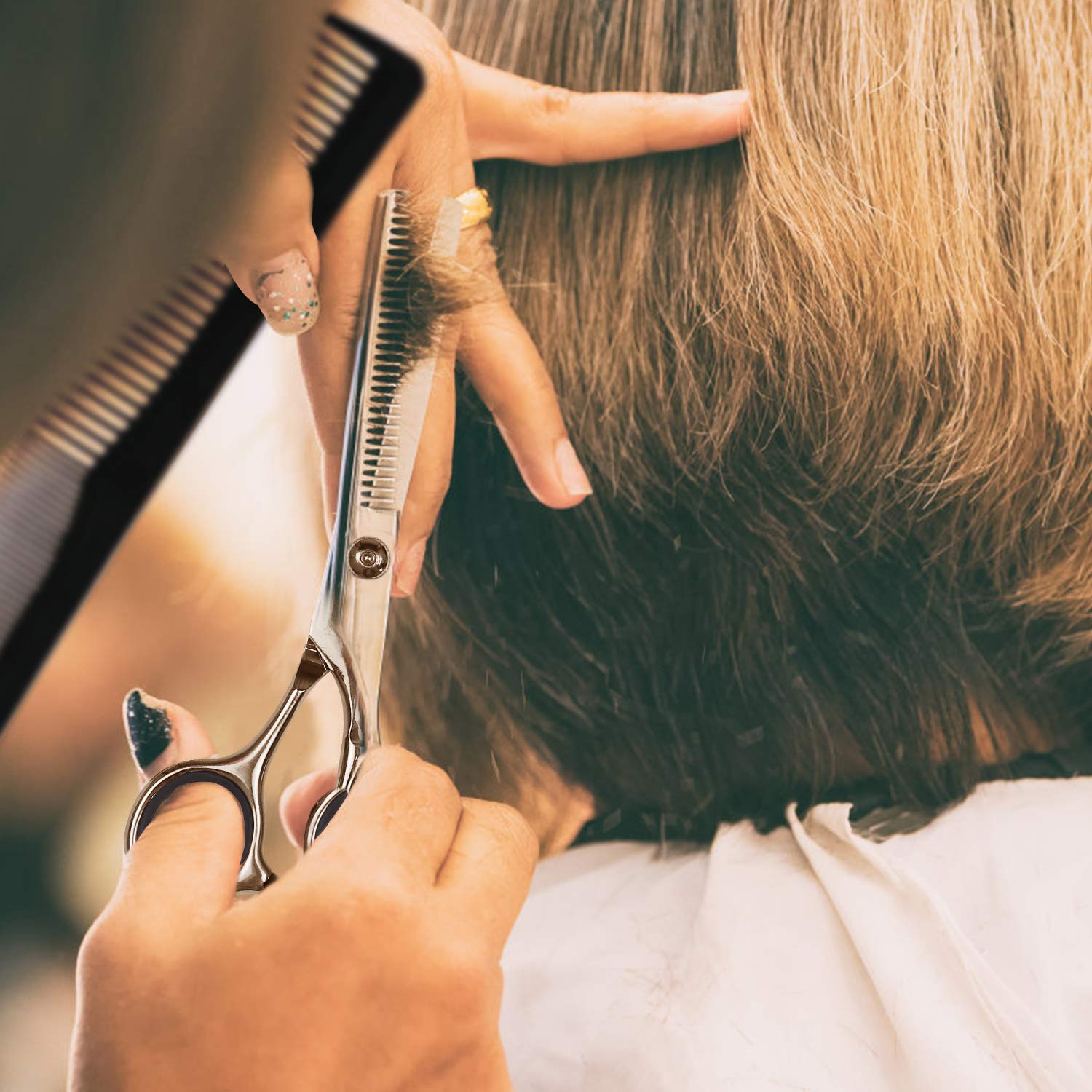 Fcysy hair thinner layering scissors demonstrating precise bulk removal on a section of hair.
