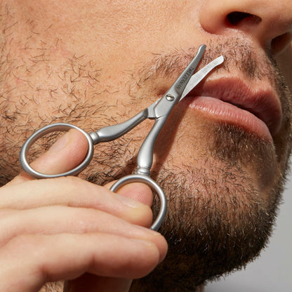 Ergonomic stainless steel scissors by Tweezerman for safe nose and ear hair trimming