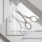 Tweezerman curved precision blade scissors highlighting the durable stainless steel finish