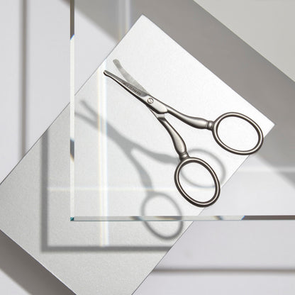 Tweezerman curved precision blade scissors highlighting the durable stainless steel finish