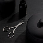 Professional grade Tweezerman facial hair scissors displaying the safe rounded tip design