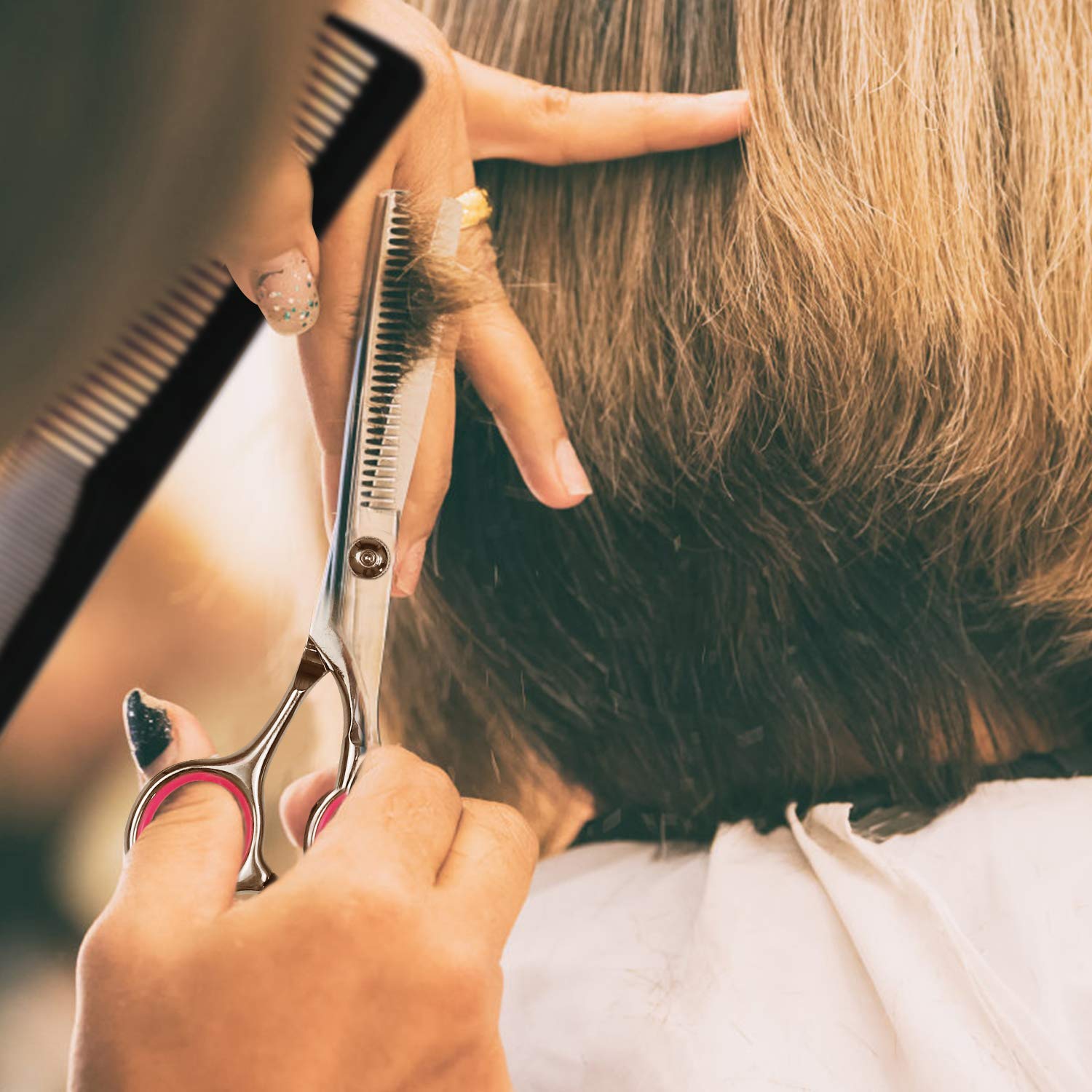 Ergonomic handles of the Fcysy professional salon shears demonstrating comfortable finger grip design