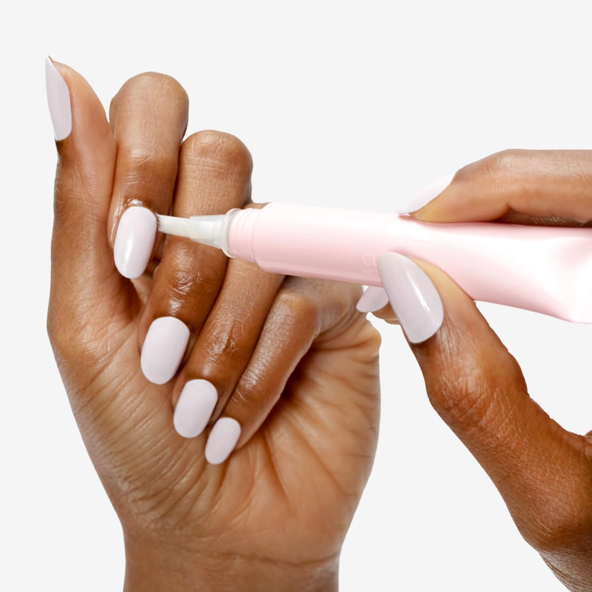 Close up of Olive And June cuticle oil brush applicator