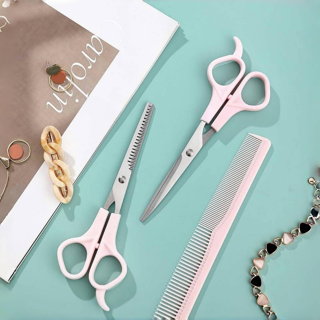 TIKMNO professional pink hair scissors being held to demonstrate ergonomic finger rest comfort