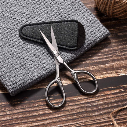 Compact mustache and beard trimming scissors demonstrating small portable size