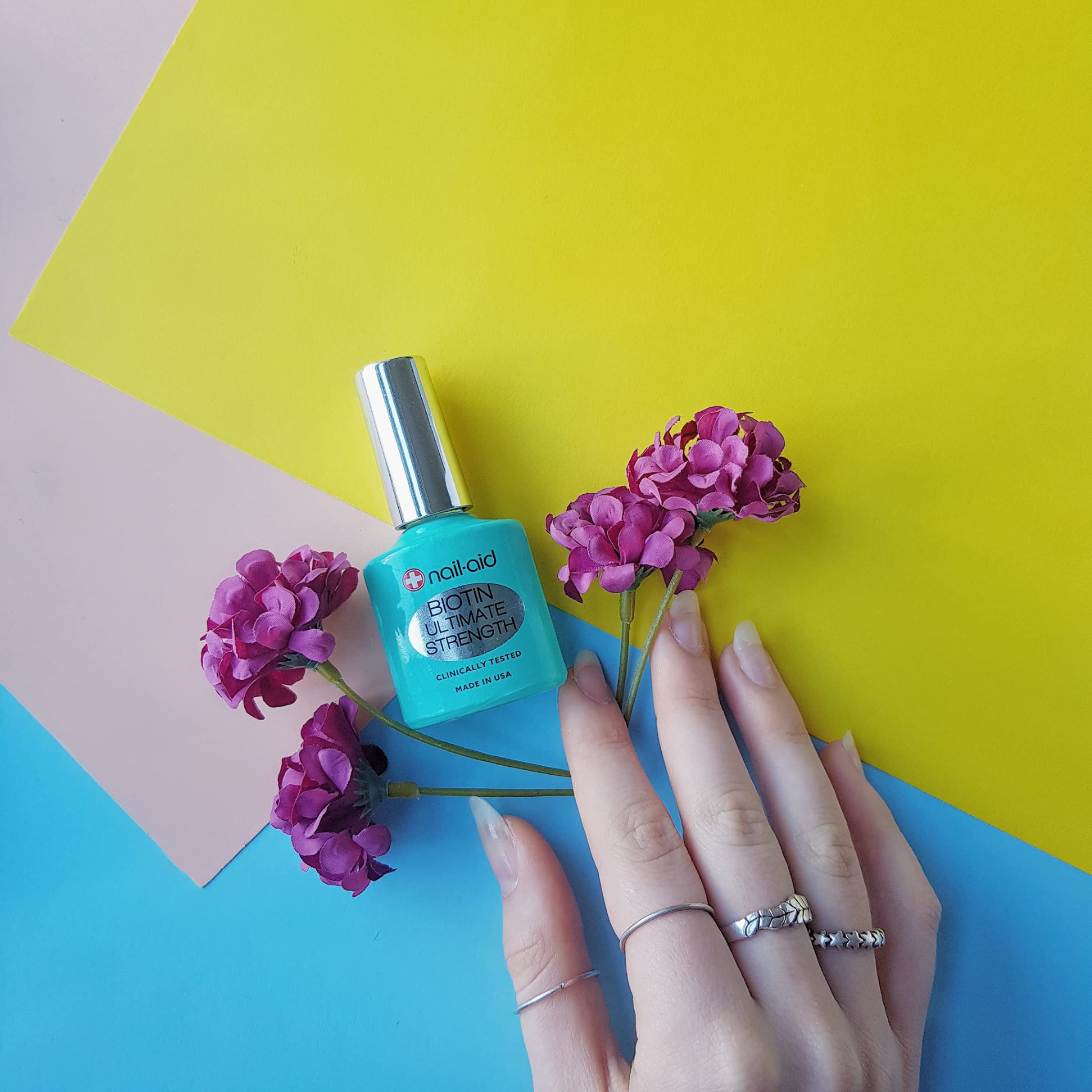 Applying Nail-Aid Biotin treatment for nail growth