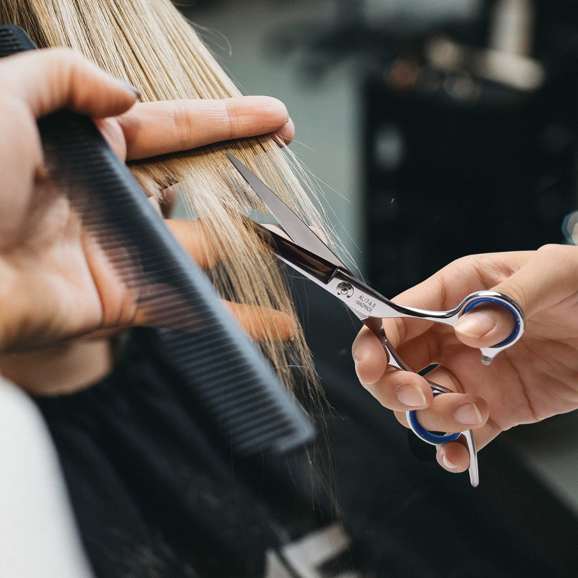 Ergonomic handle and detachable finger inserts on ULG barber scissors