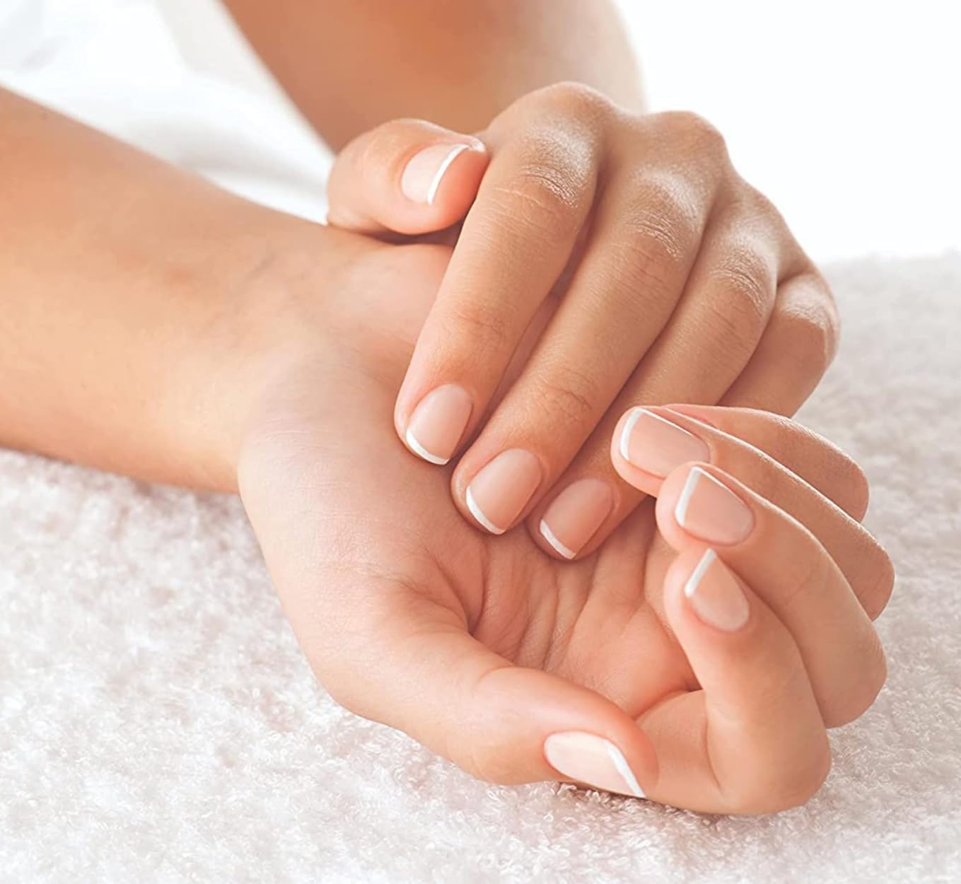 Application of Cuccio hydrating oil on natural fingernails