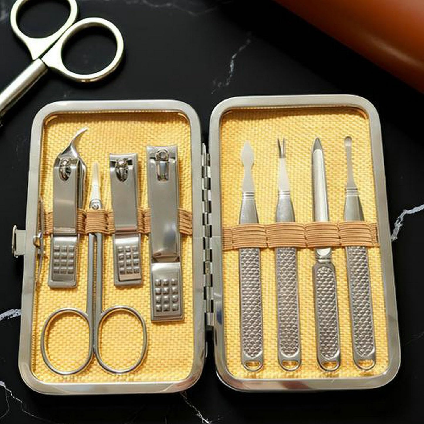 Melyfi nail grooming tools displayed outside the travel case