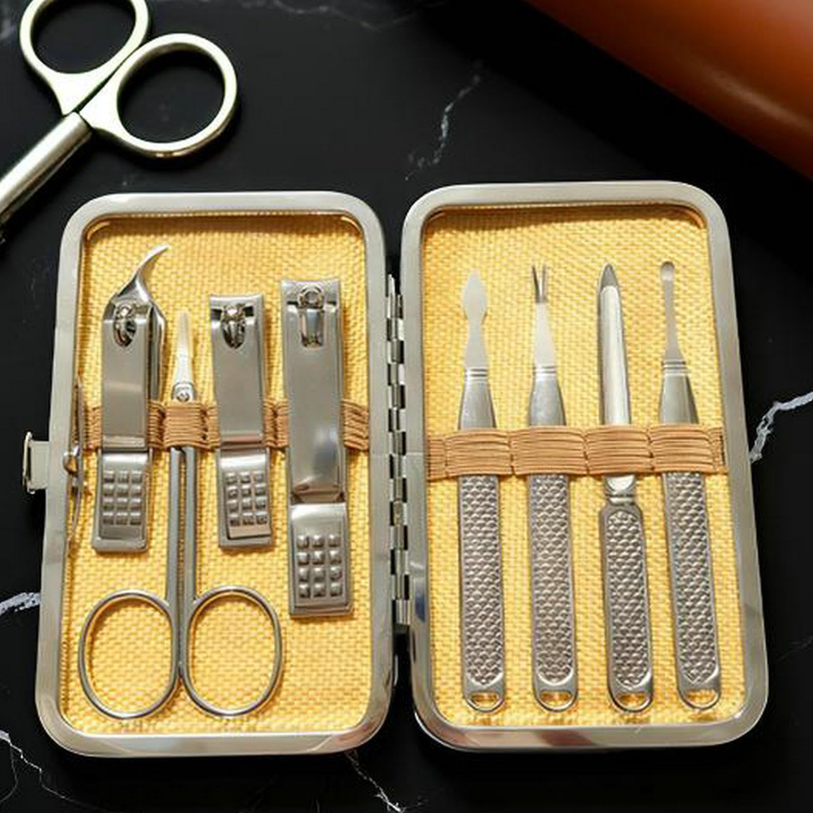 Melyfi nail grooming tools displayed outside the travel case