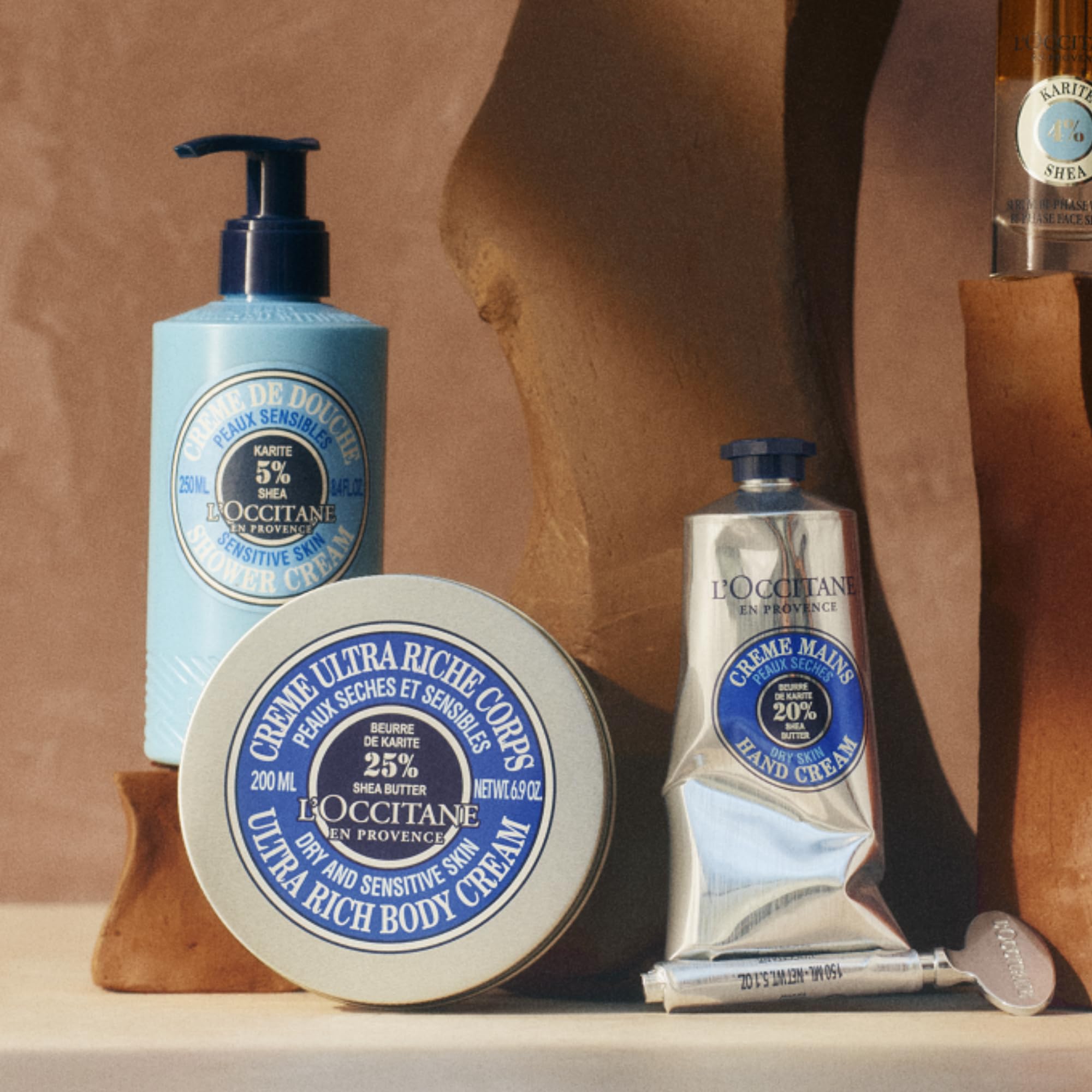 Durable metal L'Occitane Magic Key accessory for skincare.