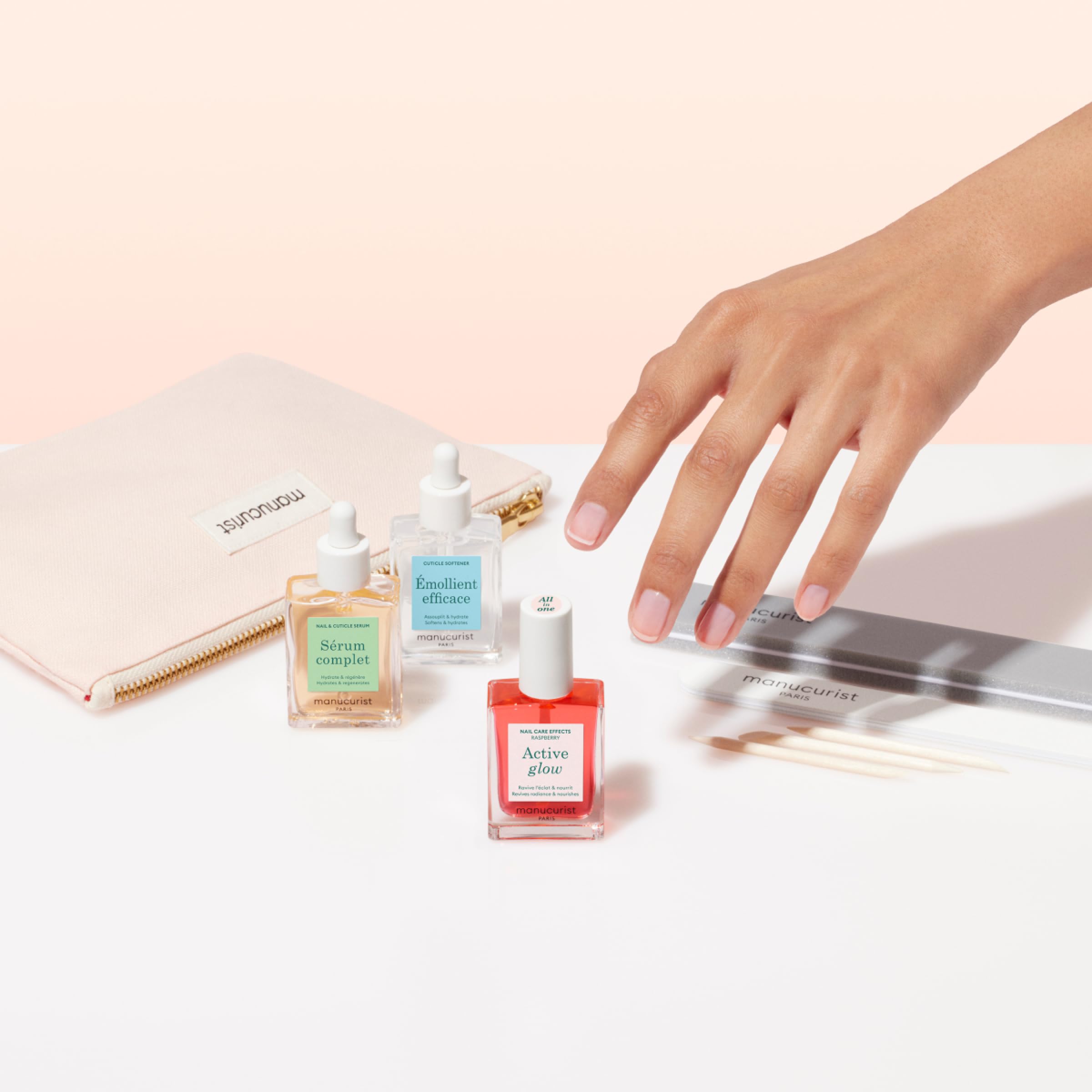 Close up of Manucurist Active Glow polish bottle and nail tools