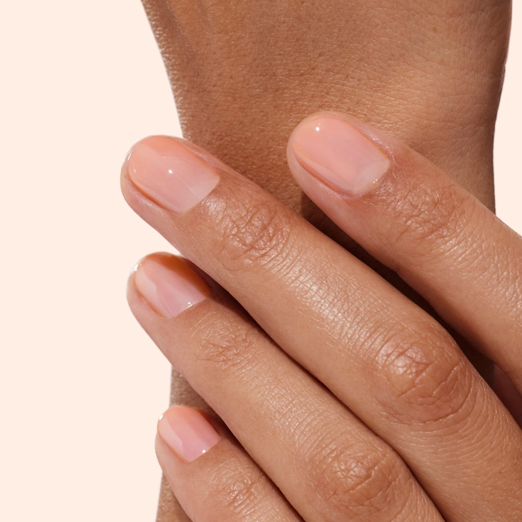 Hand model using Manucurist Active Glow polish for natural shine