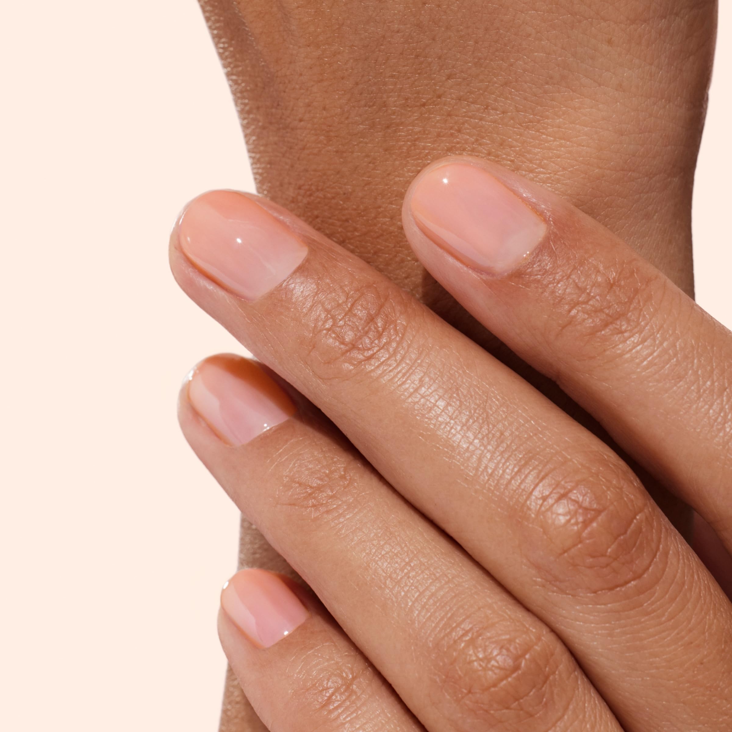 Hand model using Manucurist Active Glow polish for natural shine