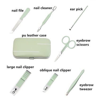 Close up of stainless steel nail care tools in green handles