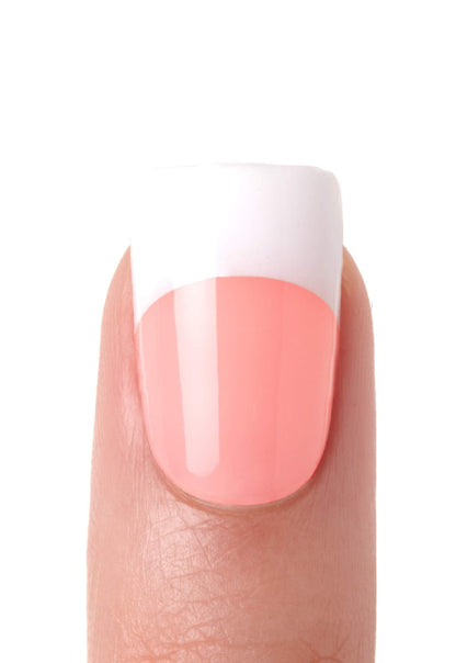 Close up of medium length French tip acrylic nails from the Kiss Salon kit