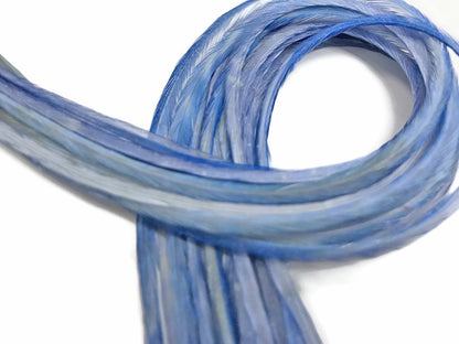 Close up detail of 11.5 inch light blue rooster hair feathers
