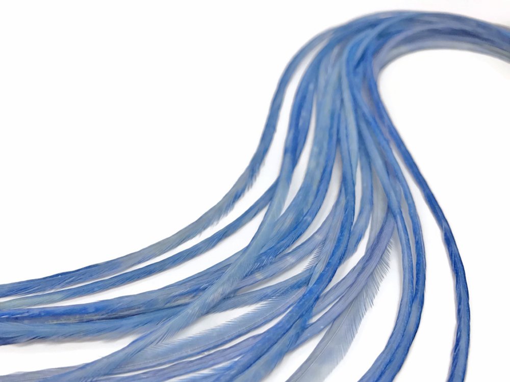 Authentic USA imported light blue hair feathers held against hair