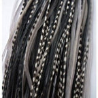 Close up of bonded tip on grey and black feather extension