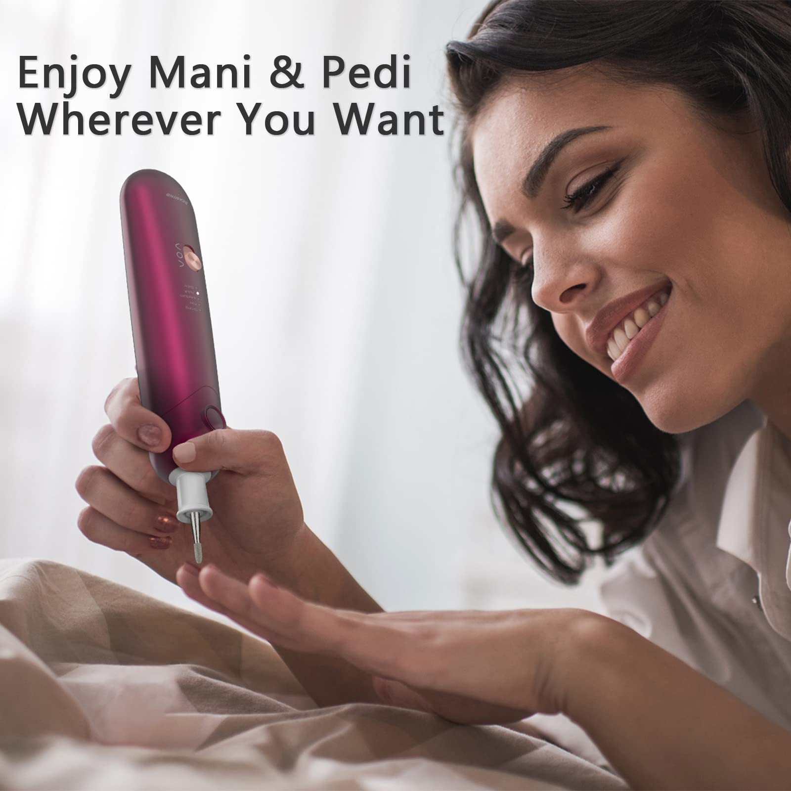 Red electric toenail buffer tool demonstrating the dual clockwise and counter-clockwise rotation feature for left or right hand use.