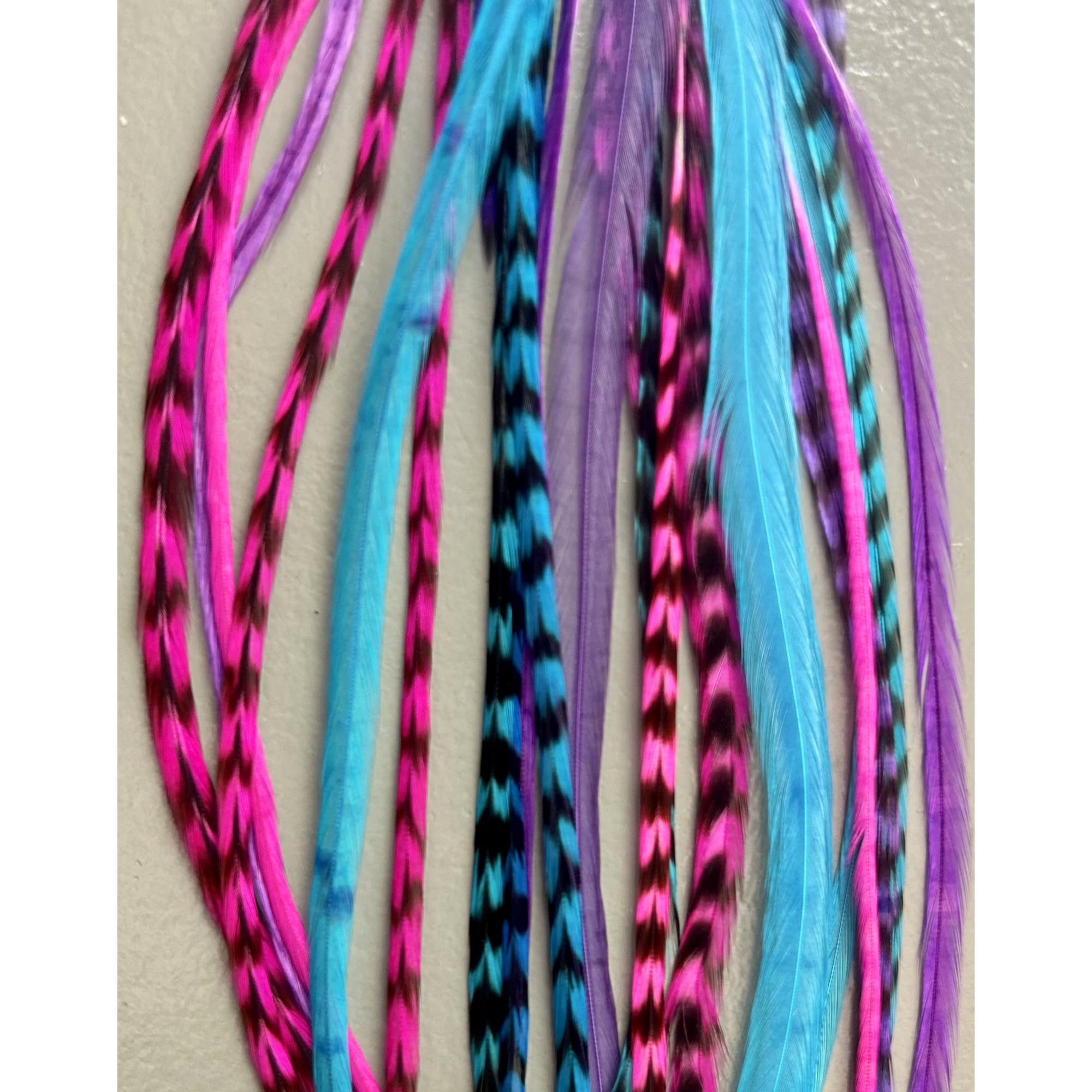 Side profile view of long hippie style feather hair clips