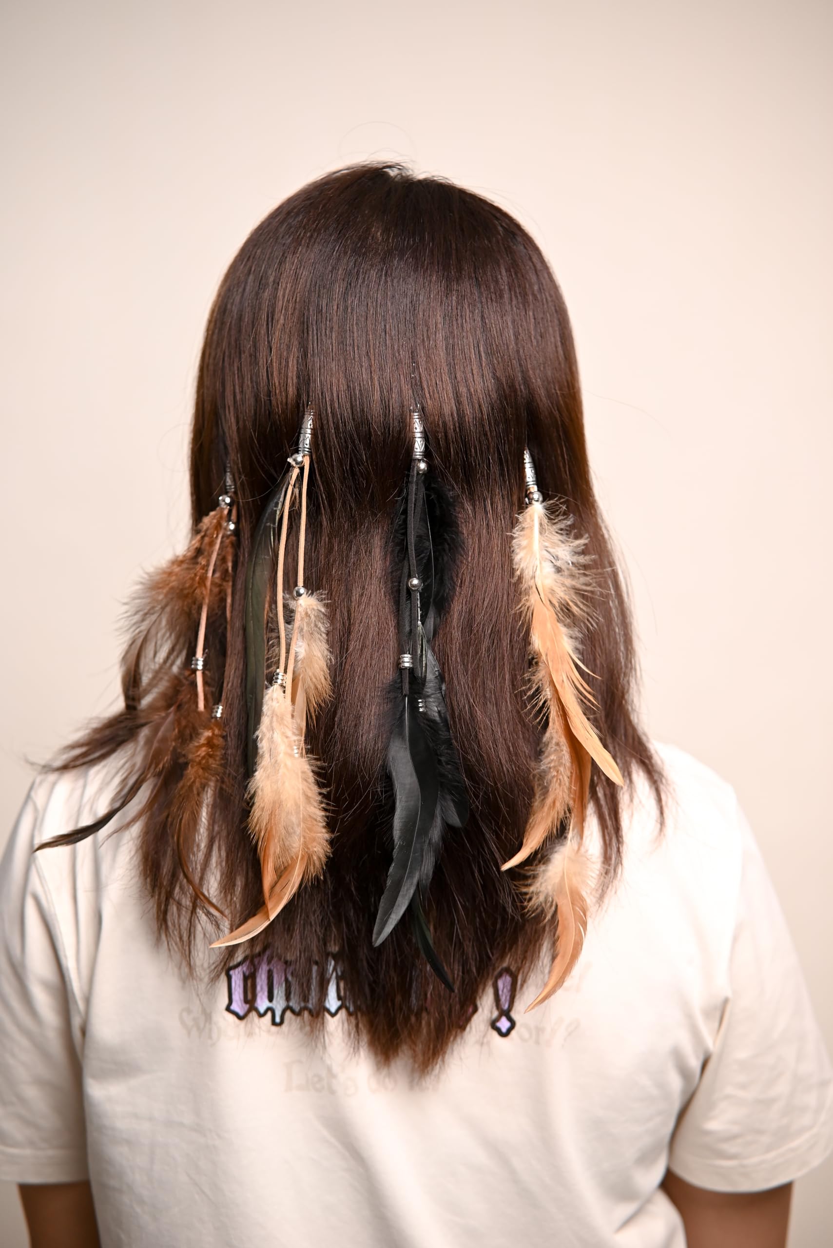 Model wearing boho feather hair extensions
