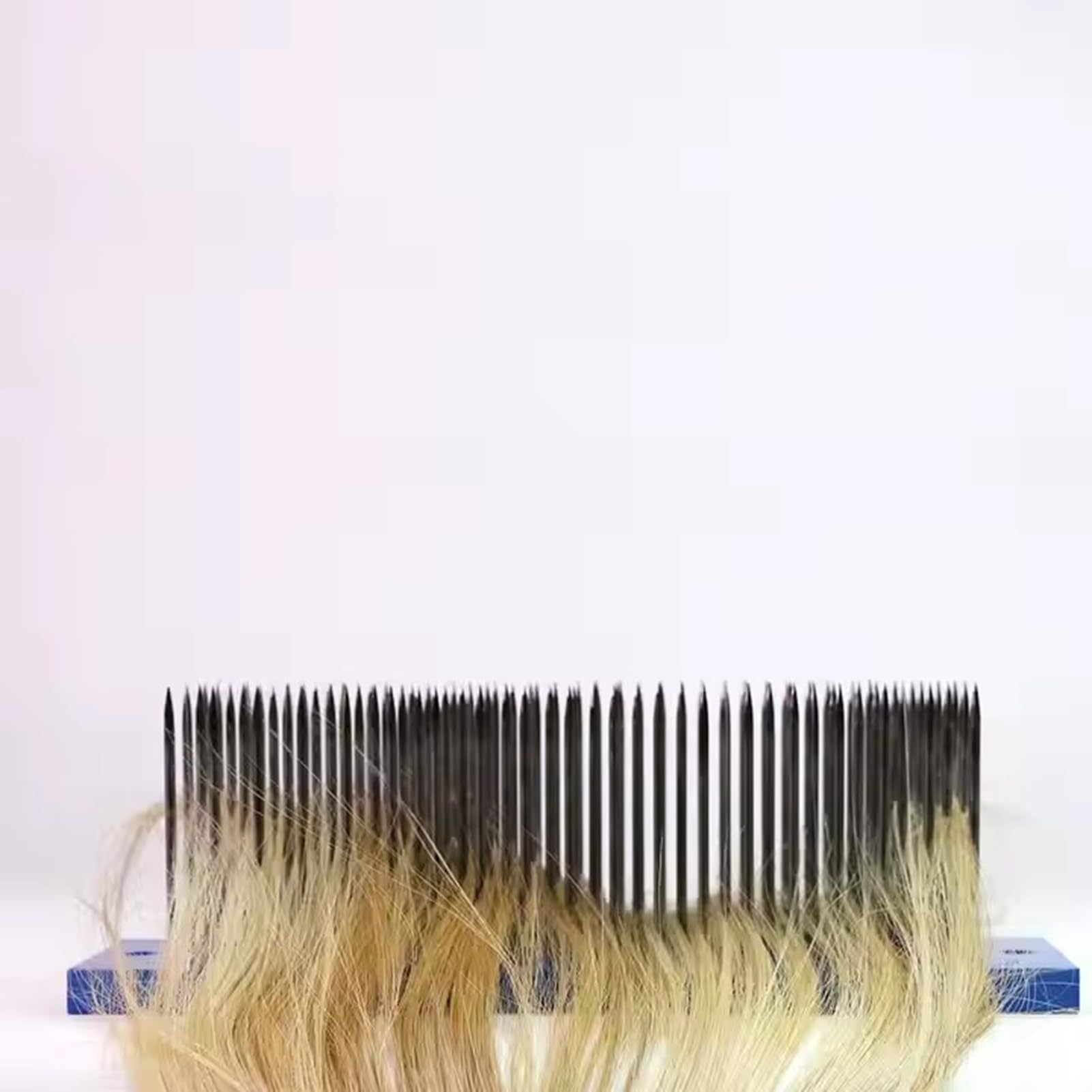 Close up of 93 stainless steel needles on SUZLAZYR hair hackle