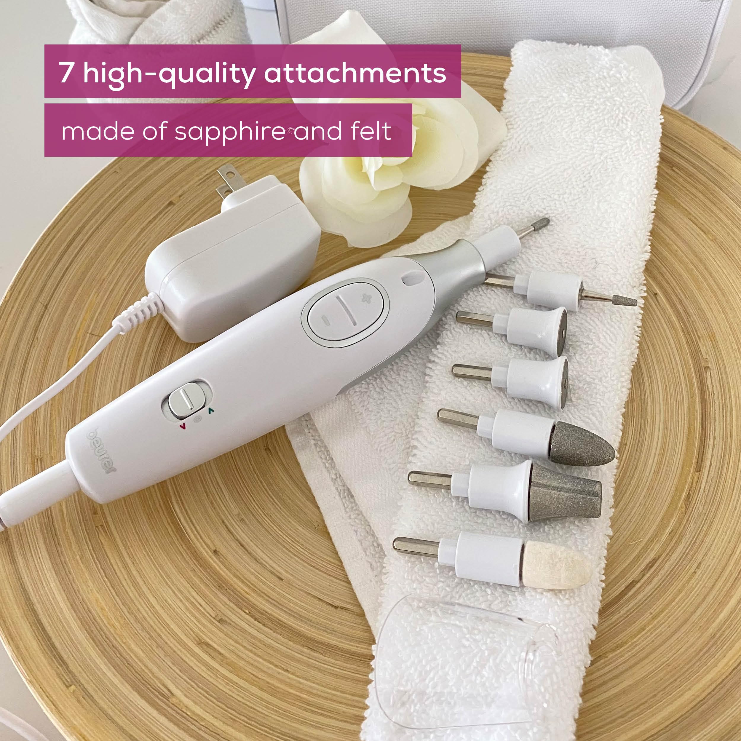 Beurer 7-in-1 electric nail drill kit with seven sapphire attachments laid out next to device
