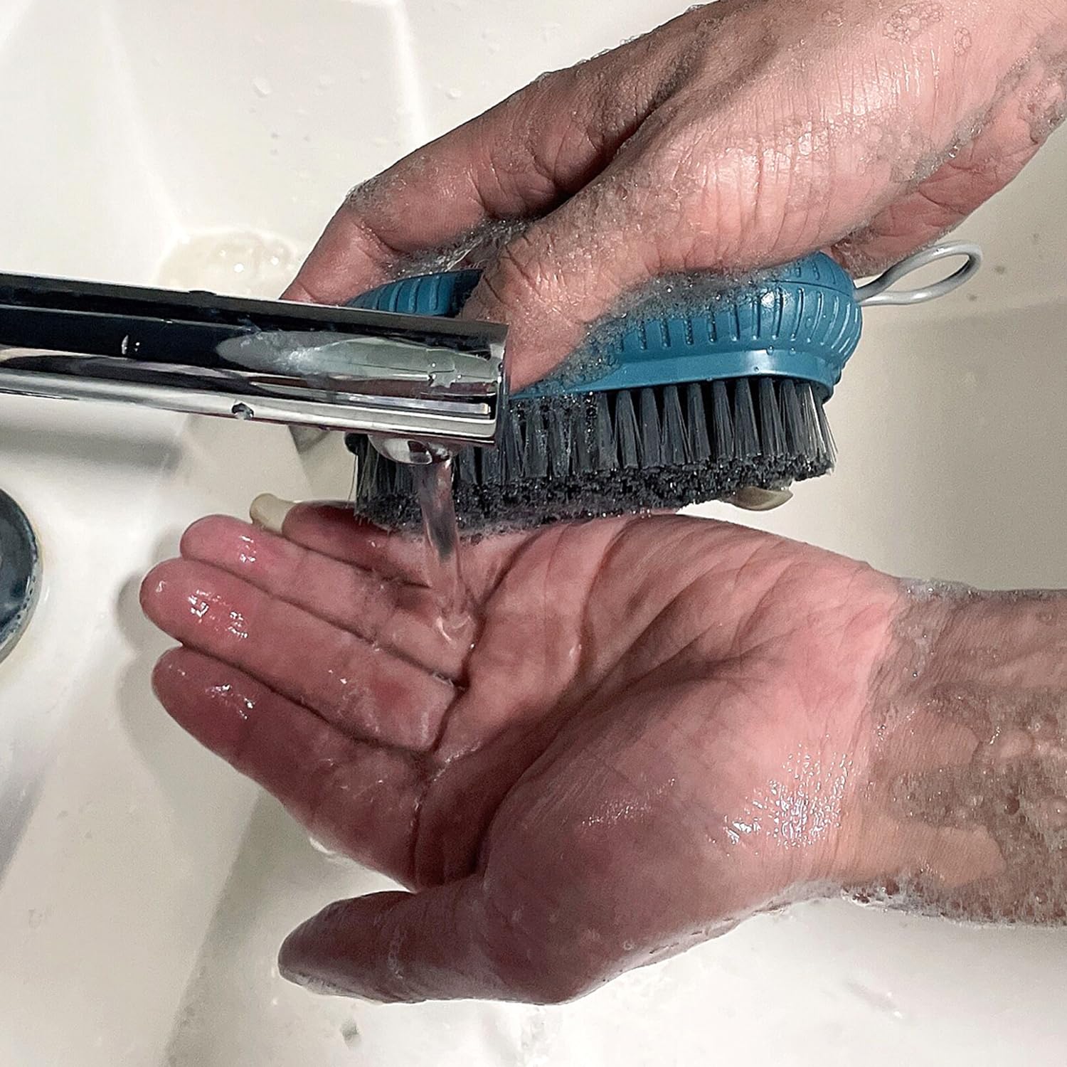 Sxmqhy imported nail cleaning tool showing the integrated hanging hole design with rope for easy bathroom storage.