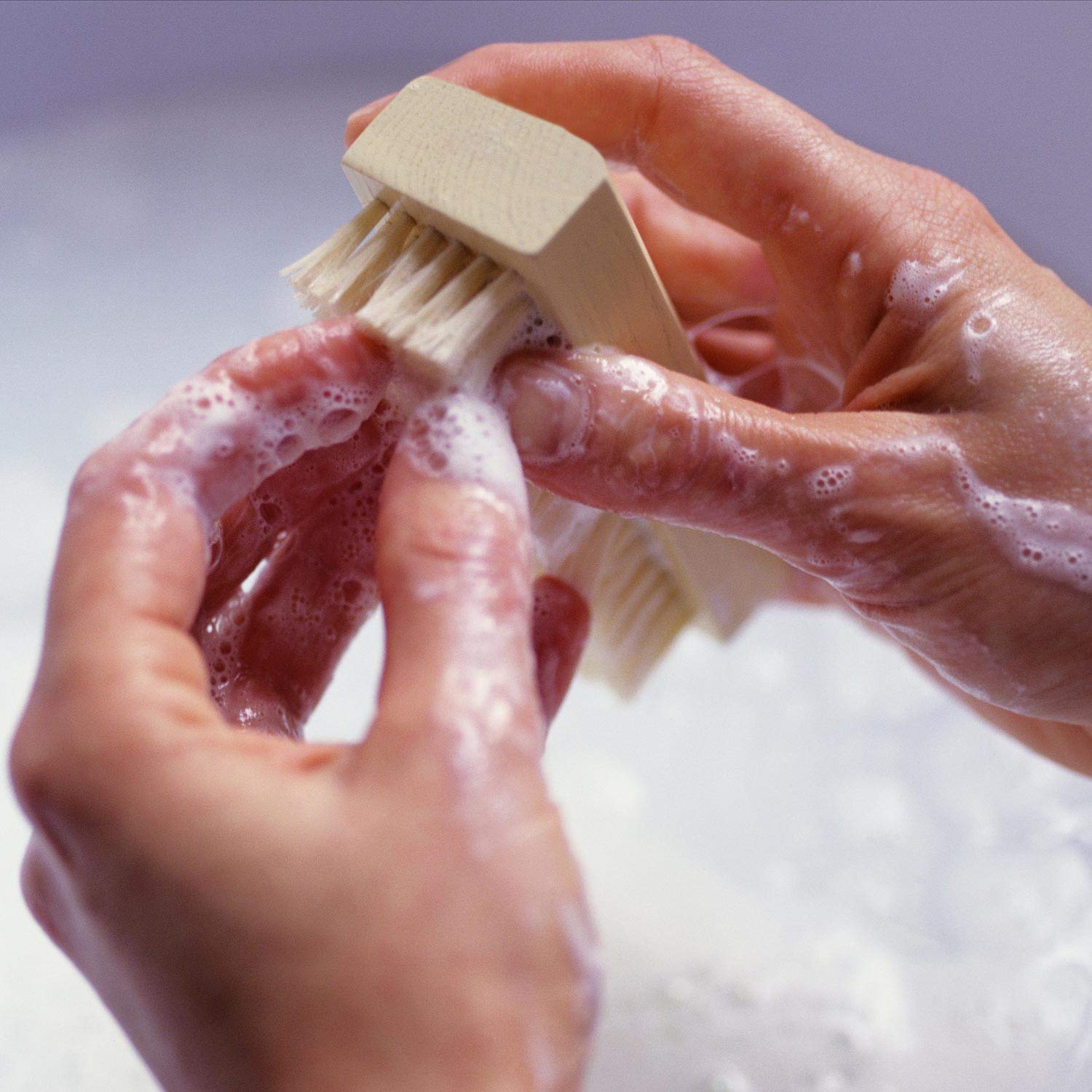 Side profile of LoveBB wooden pedicure brush demonstrating the comfortable ergonomic grip shape