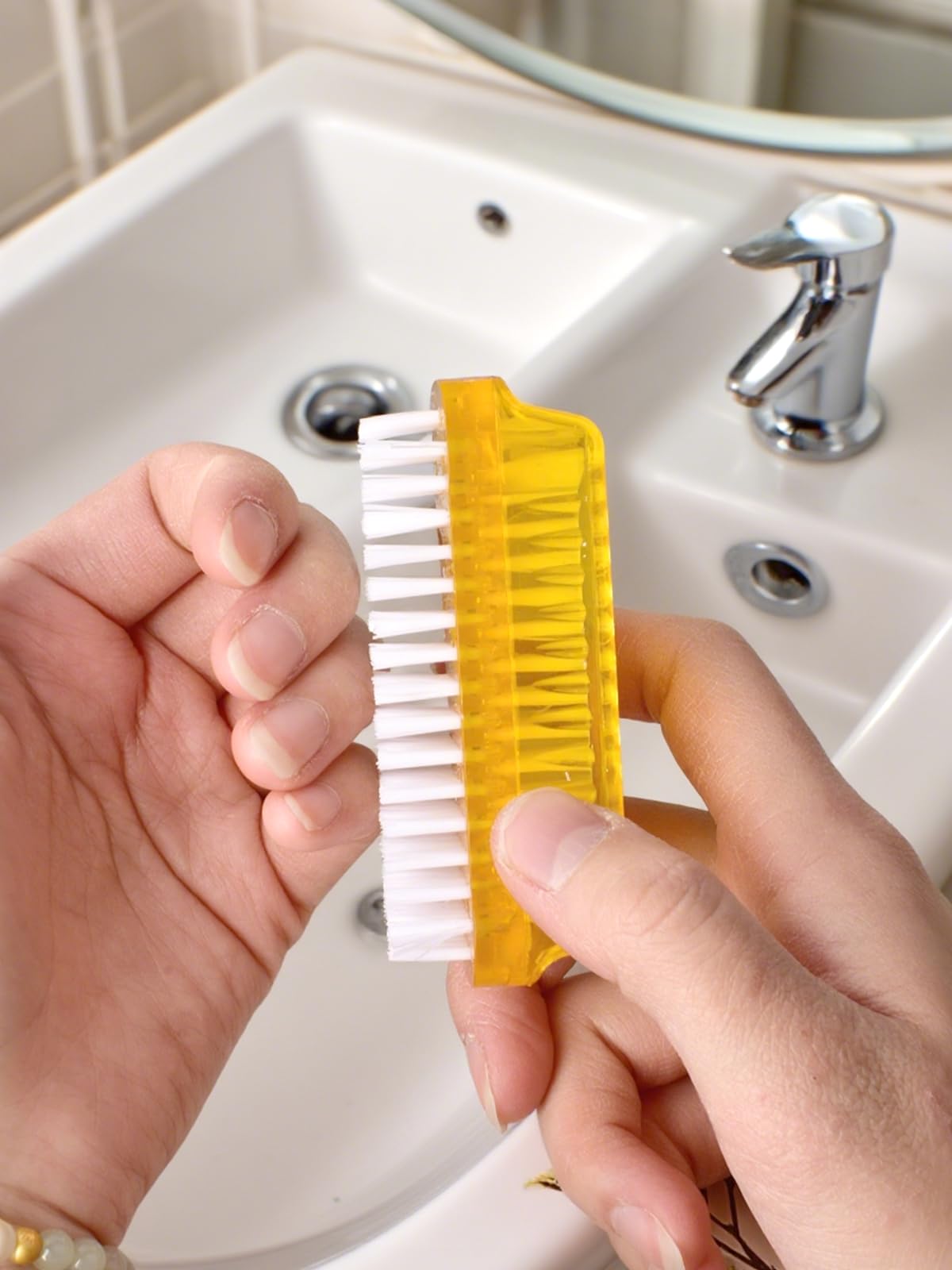 Close up of the firm bristles on the double sided manicure pedicure brush tool