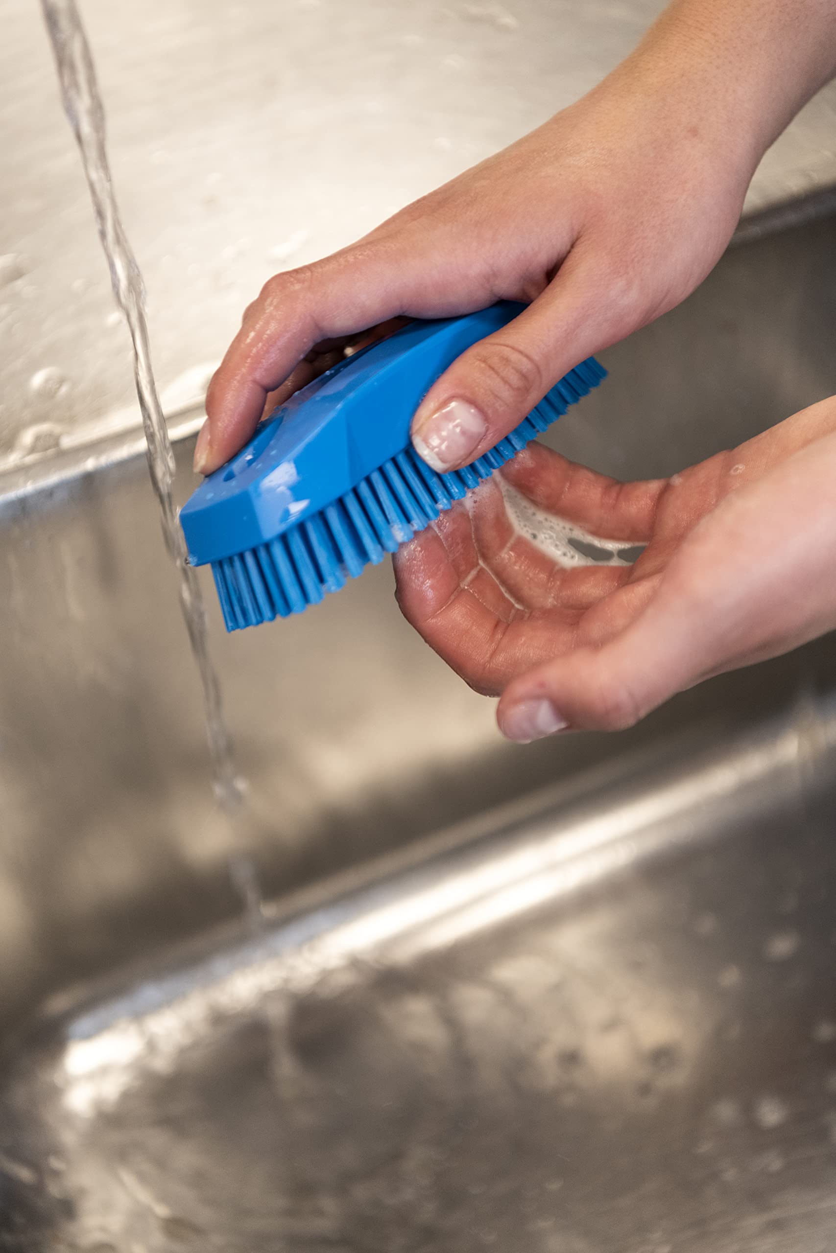Hand scrubbing with Vikan 64403 blue nail brush