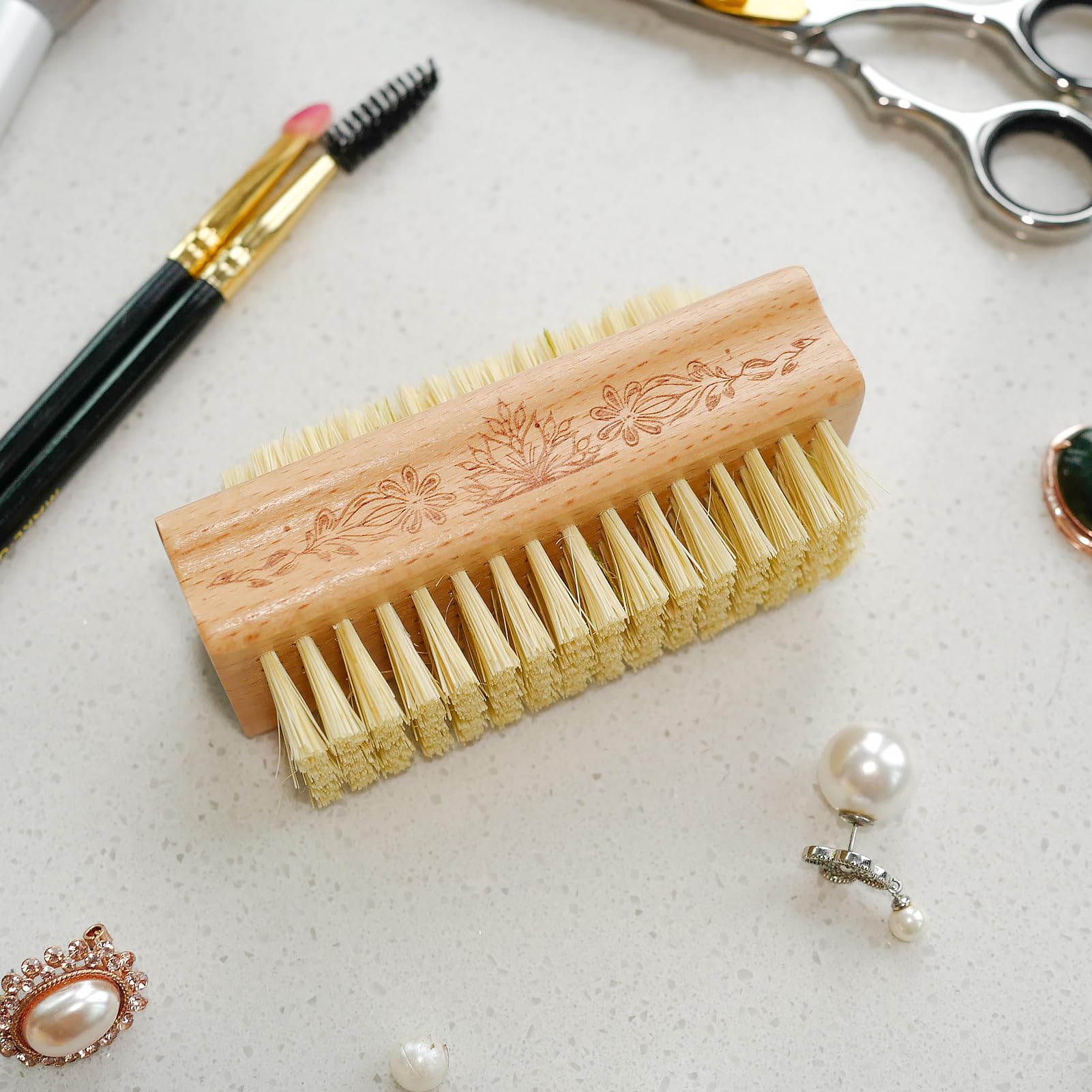 Menesia wooden nail care scrubber resting on a dry surface illustrating proper storage and ventilation position