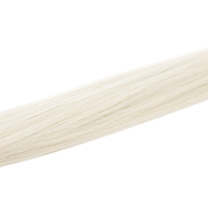 Complete set of twelve pieces of premium platinum blonde straight hair streaks laid out evenly to show product volume.