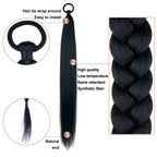 Detailed view of the elastic tie on the black synthetic hairpiece