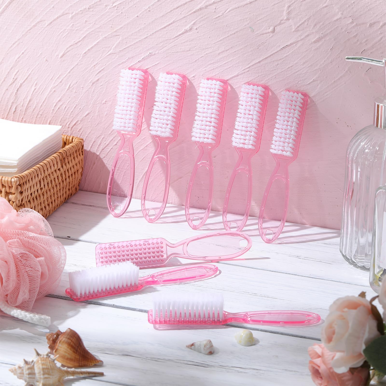 Patelai clear pink plastic nail brushes showing stiff bristles