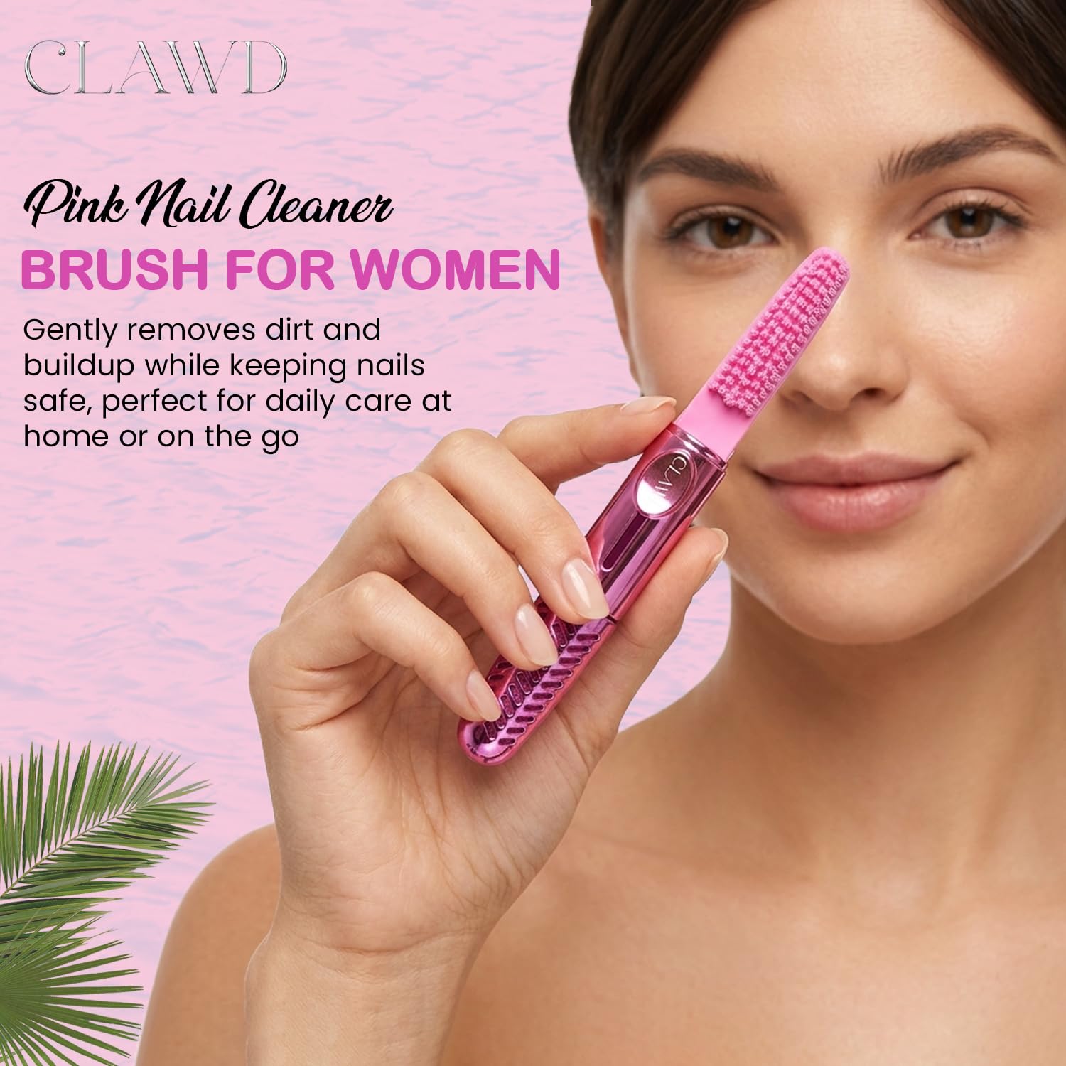 Close up view of the soft bristles on the pink portable travel nail cleaner