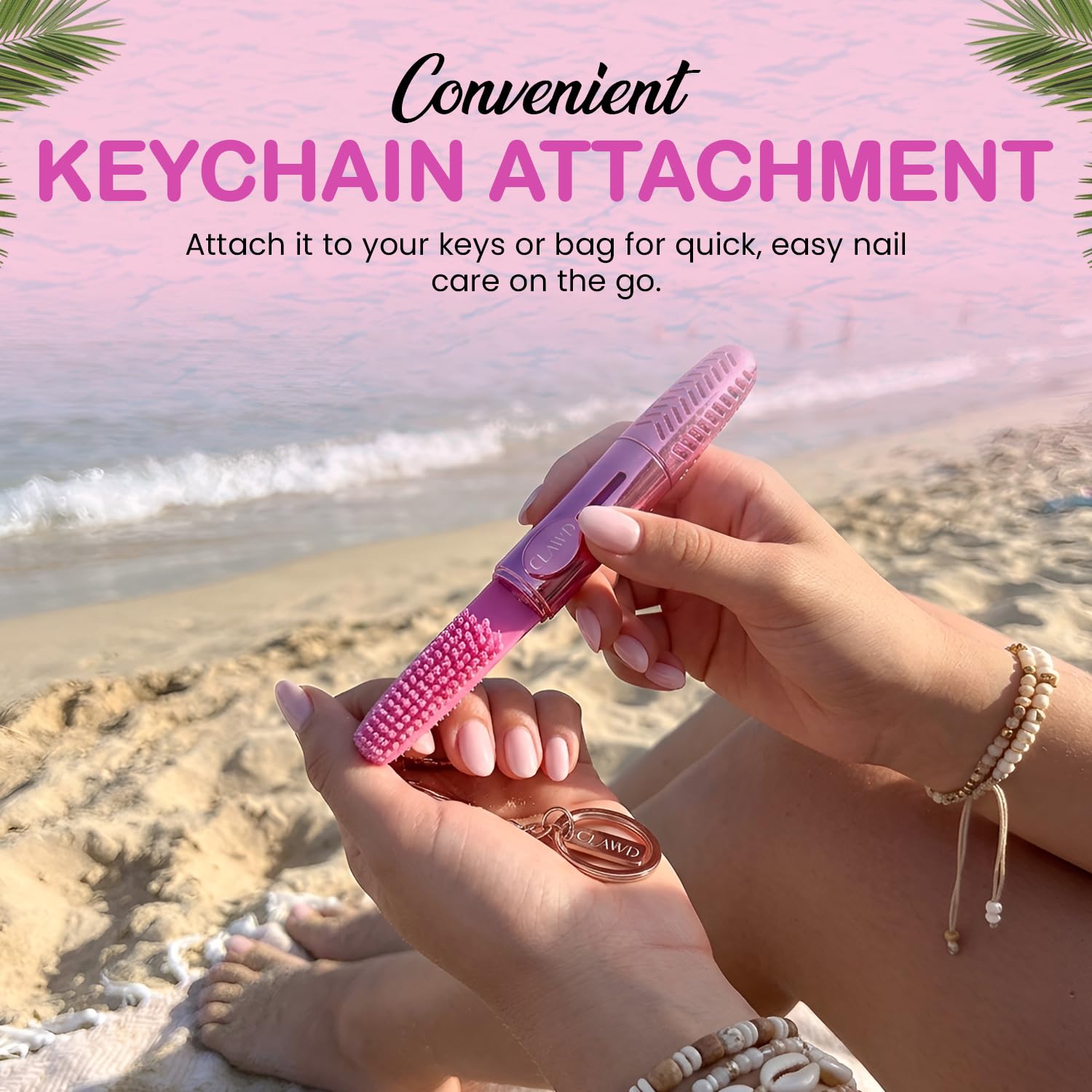 Side angle of the compact CLAWD manicuring brush highlighting the travel keychain ring