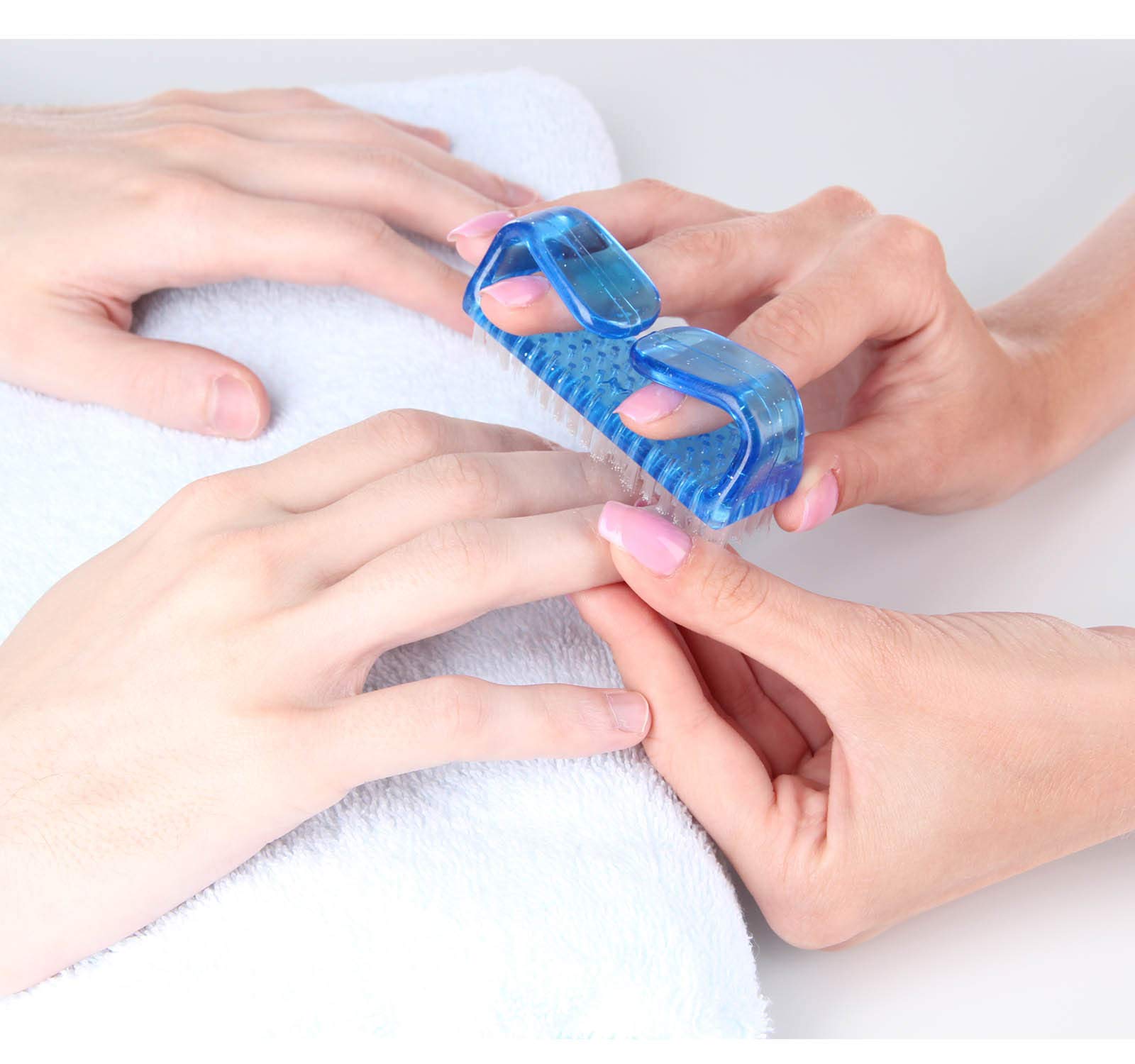 Four colorful plastic nail cleaning brushes arranged neatly to demonstrate color coding utility