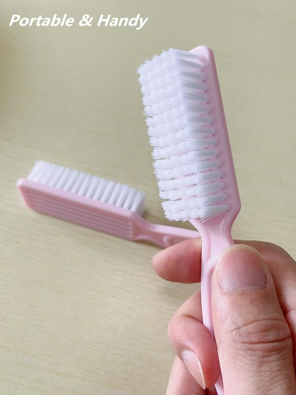 Pink manicure pedicure scrubbing brush with ergonomic handle grip close up view