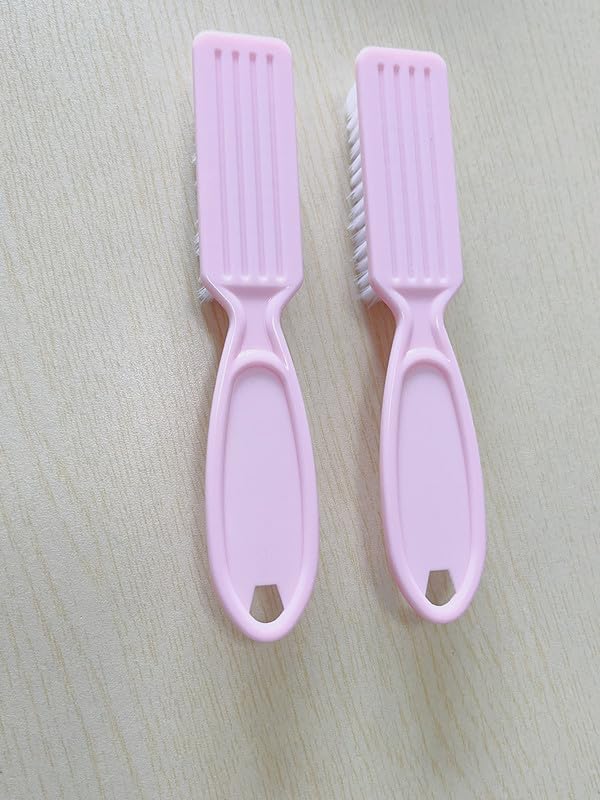 Compact handle grip nail brush being held for hand hygiene maintenance