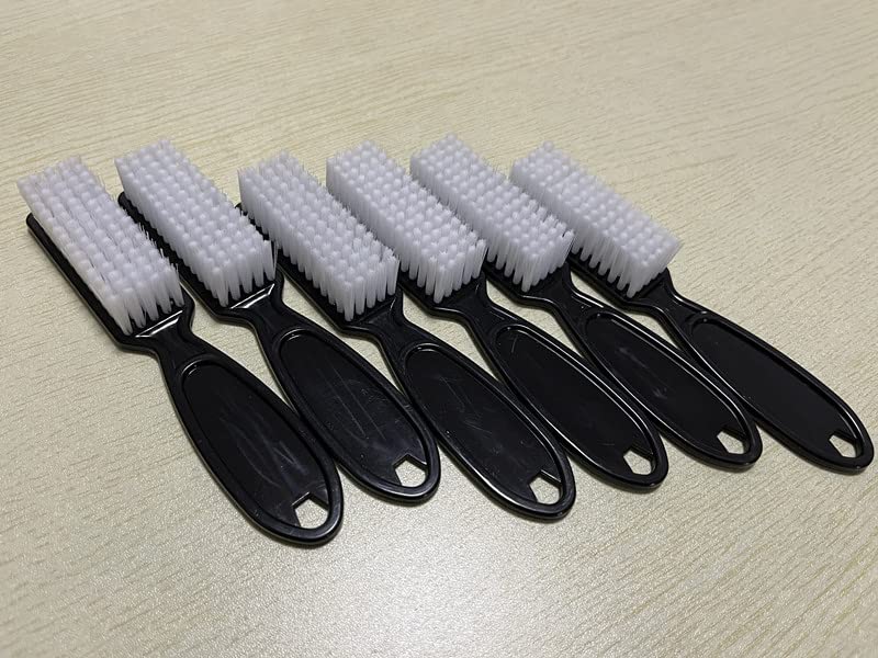 Multi purpose pedicure tool being used to clean beneath toenails.