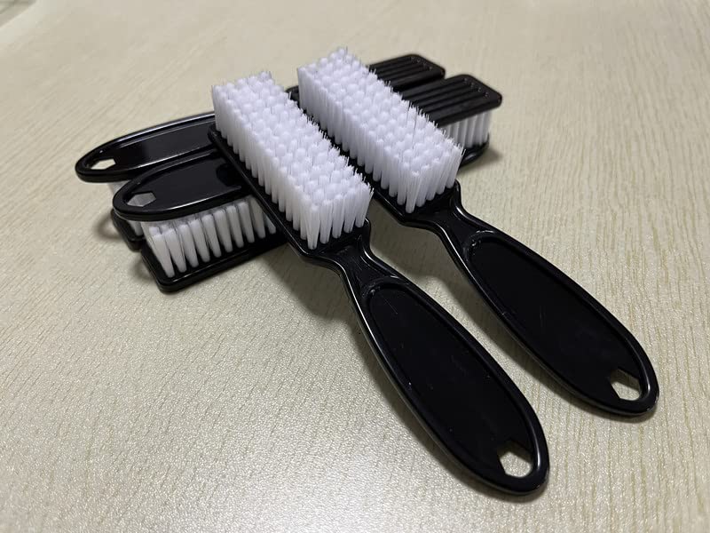 Manicure scrubbing brushes hanging on a hook via the integrated storage hole.