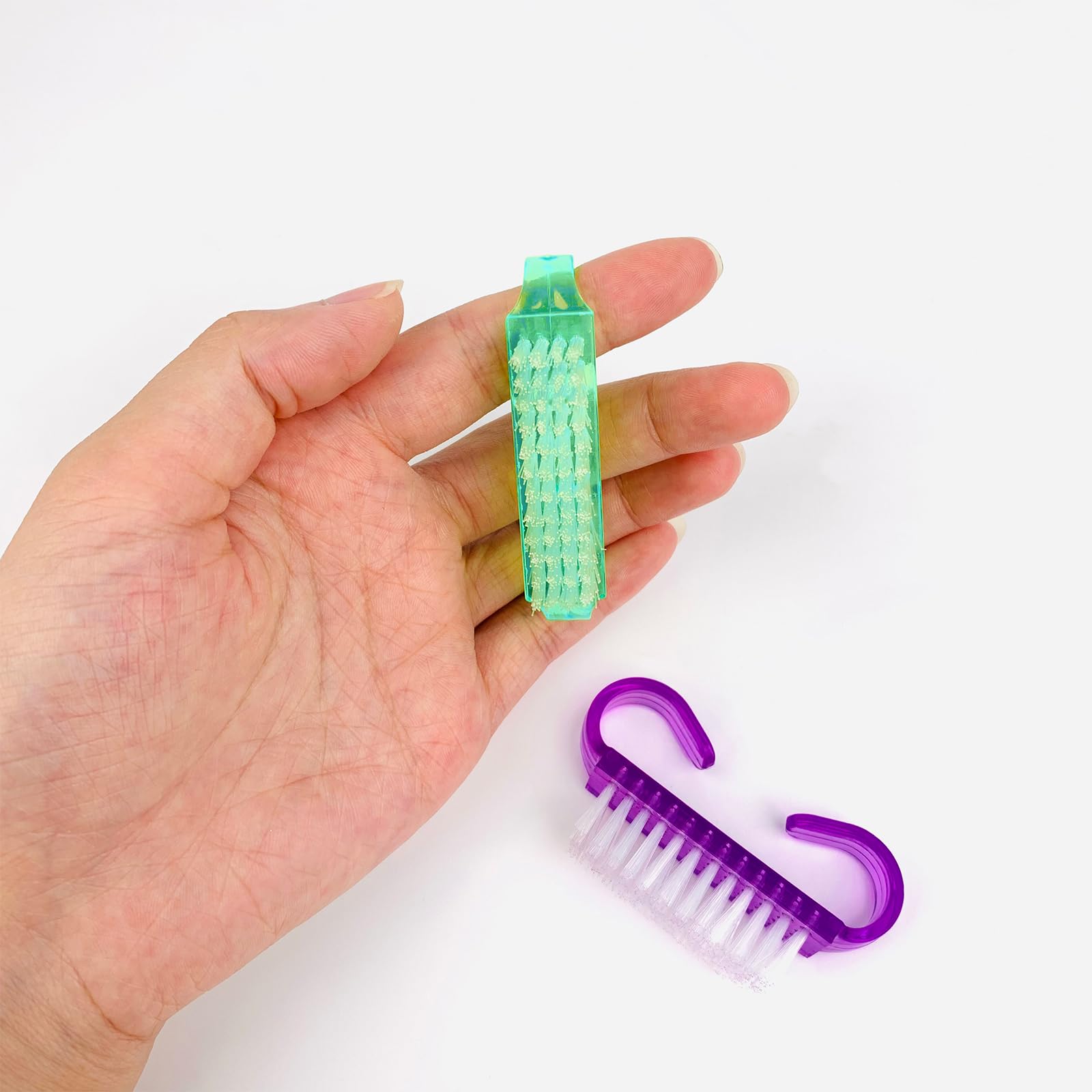 Four different colors of the HANWER manicure and pedicure brush set arranged neatly to display the color options