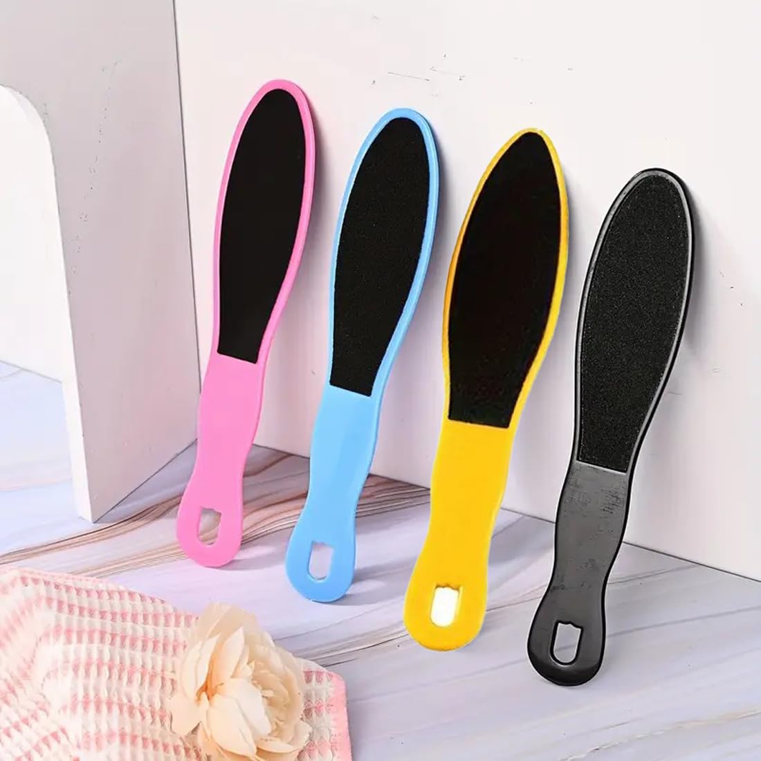 Person using Rneswi disposable foot scrubber on heels