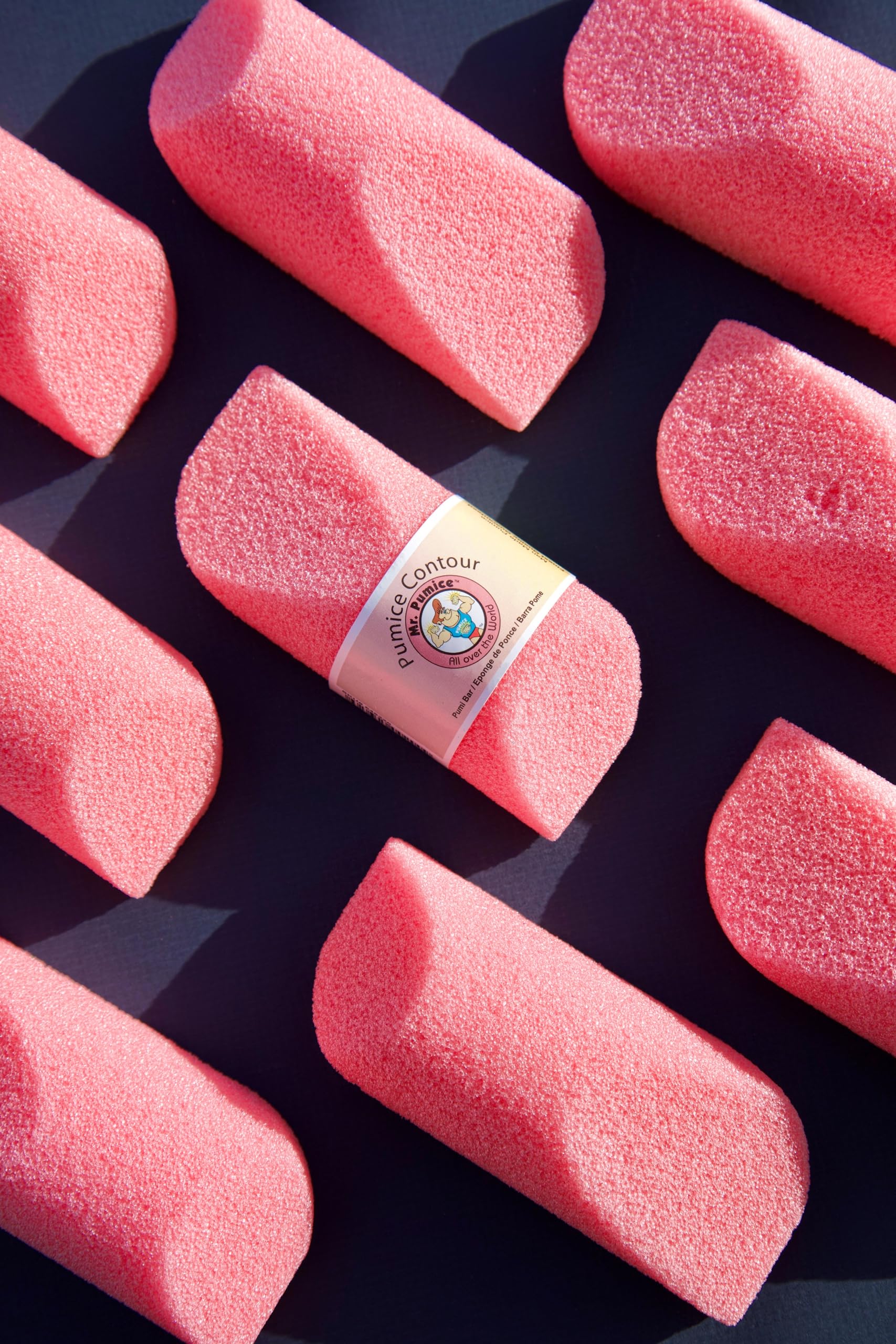 Using Mr. Pumice Pink Contour Bar on hand for smoothing
