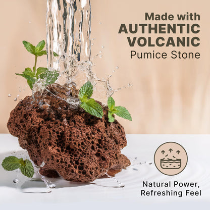 Extra large natural foot scrubber stone held in hand illustrating ergonomic shape and sizing.