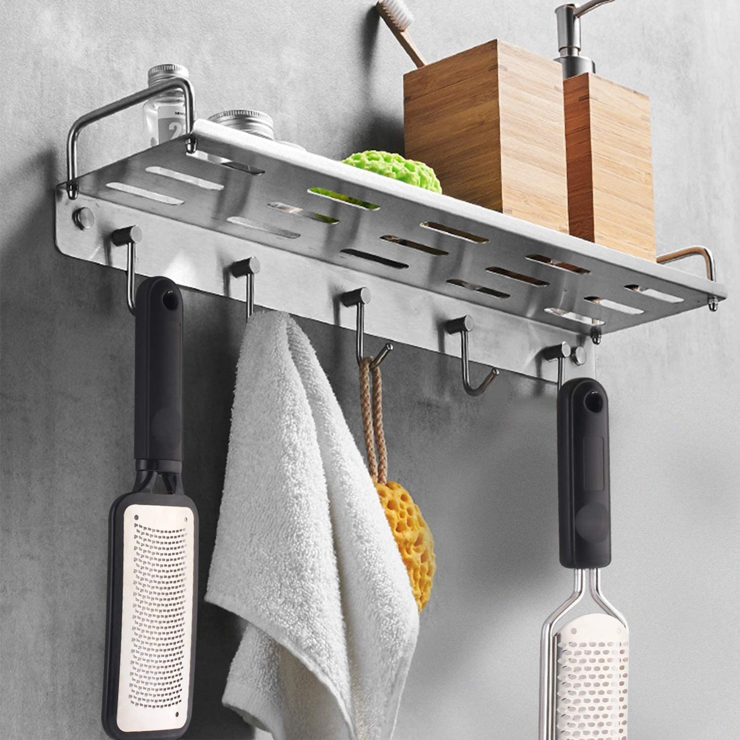 Washable and reusable stainless steel foot grater being rinsed under water for clean maintenance.