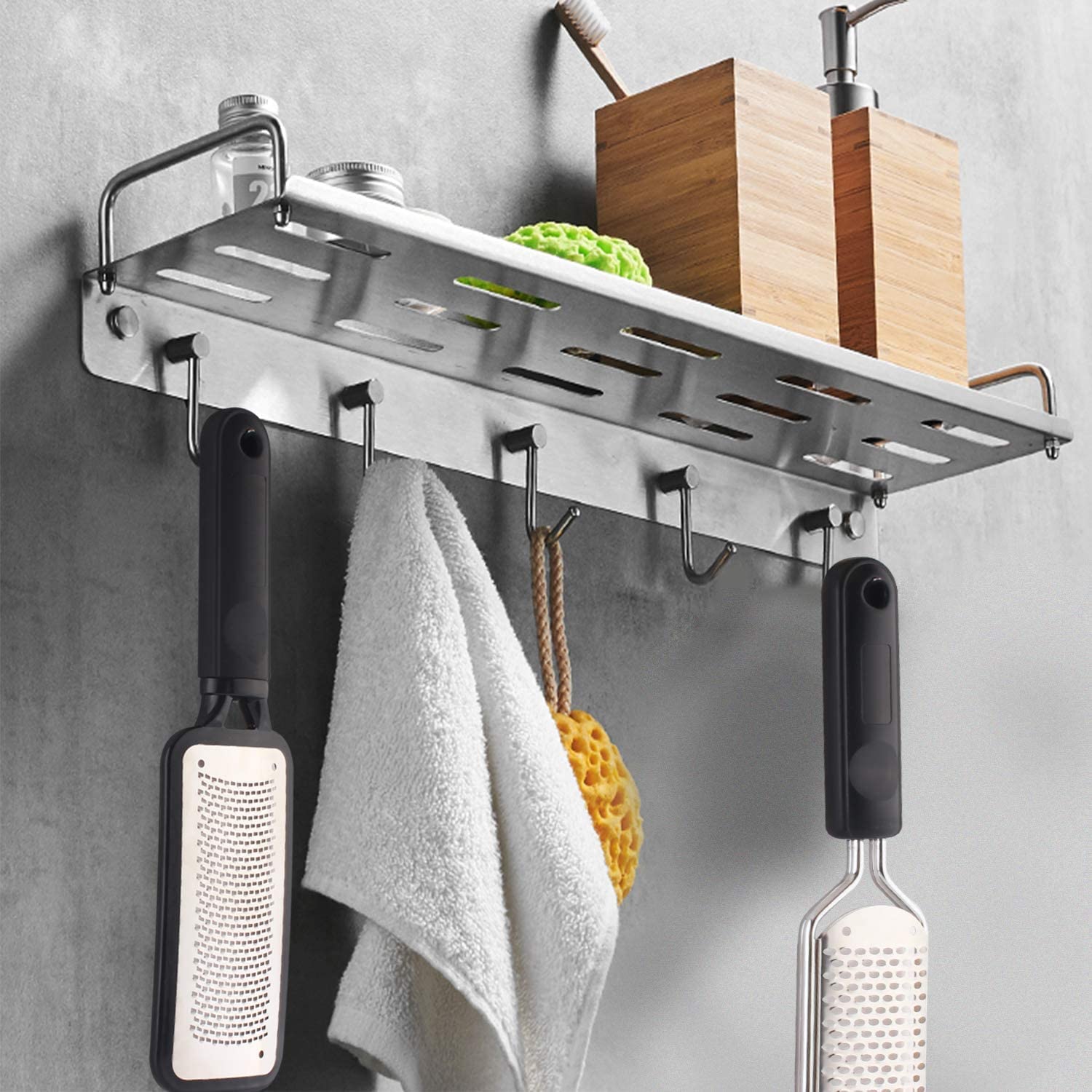 Washable and reusable stainless steel foot grater being rinsed under water for clean maintenance.